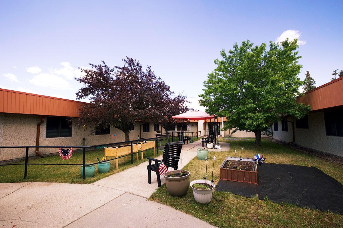 Backyard with flowerbeds at Copper Ridge Health and Rehab
